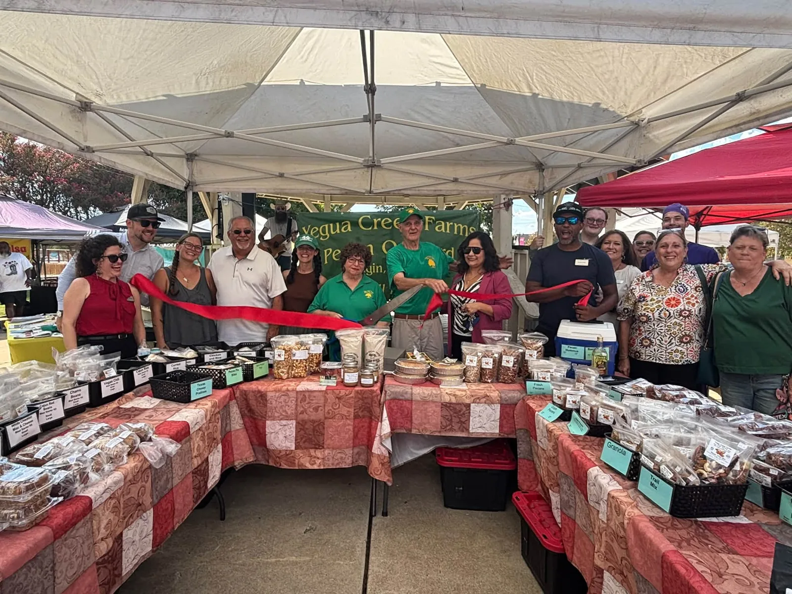 The Yegua Creek Farms stand at a farmers market.